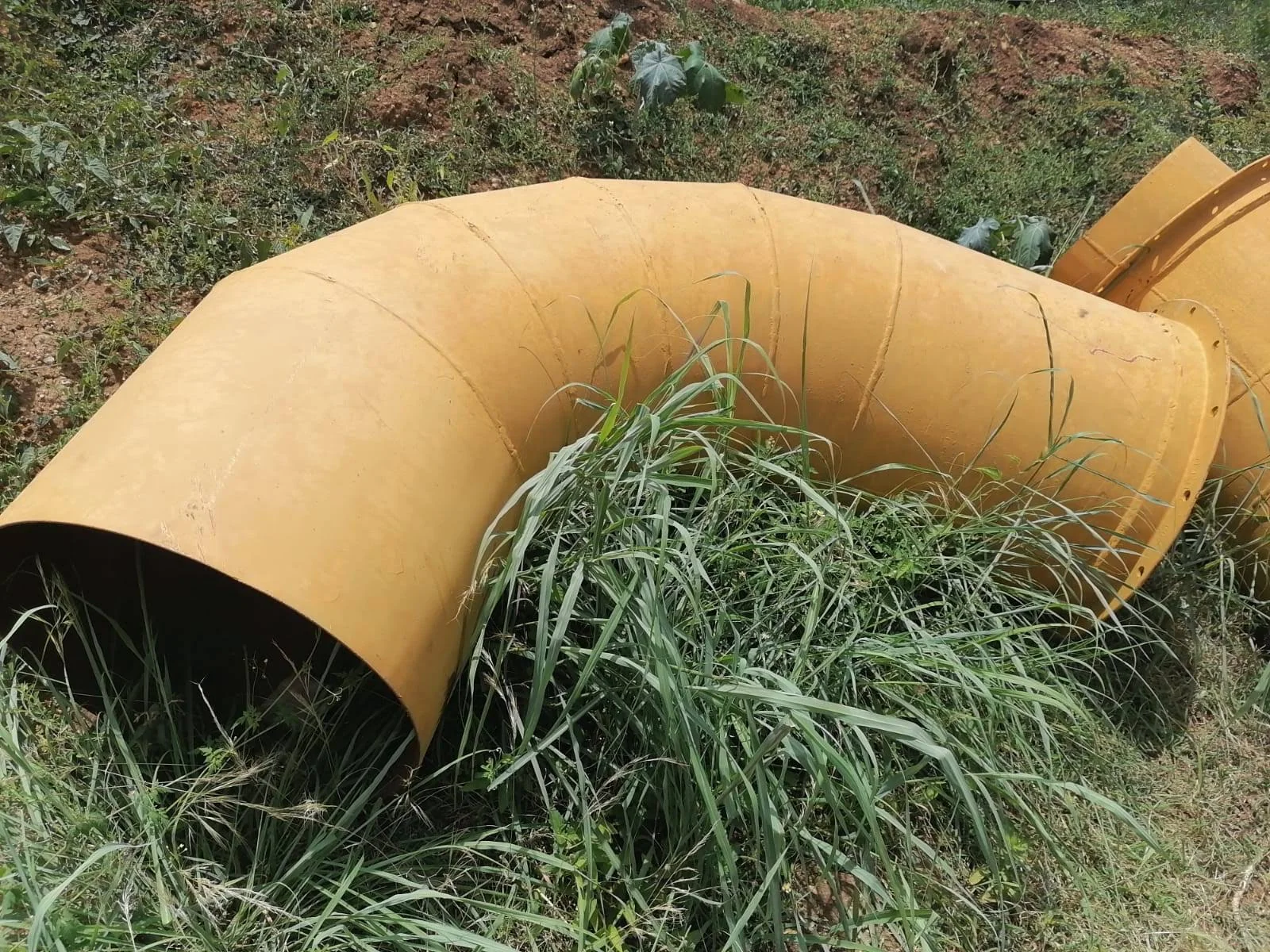 Rubber lined pipe bends for chemical processing
